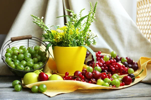 Still life with berries and flowers