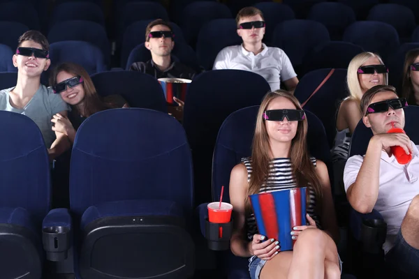 People watching movie in cinema