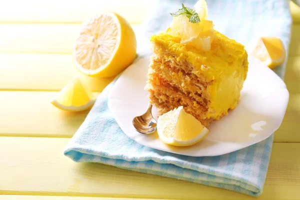 Tasty lemon dessert on wooden table