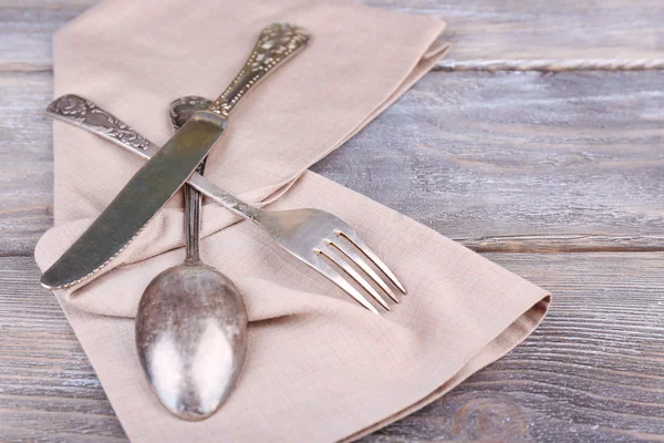 Old vintage silverware on wooden table