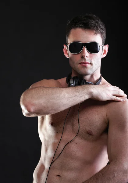 handsome man listening to music on headphone — Stock Photo #28135681