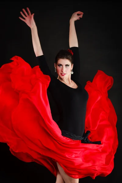 Dance. Spanish girl in red skirt dancing flamenco
