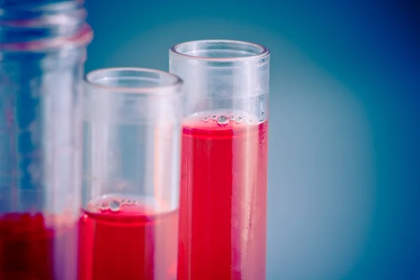 Test tubes with red liquid in laboratory — Stock Photo #38454417