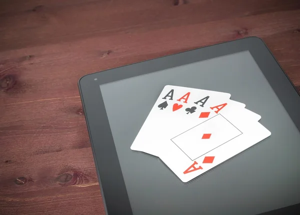Poker cards on digital tablet pc, concept of texas poker online