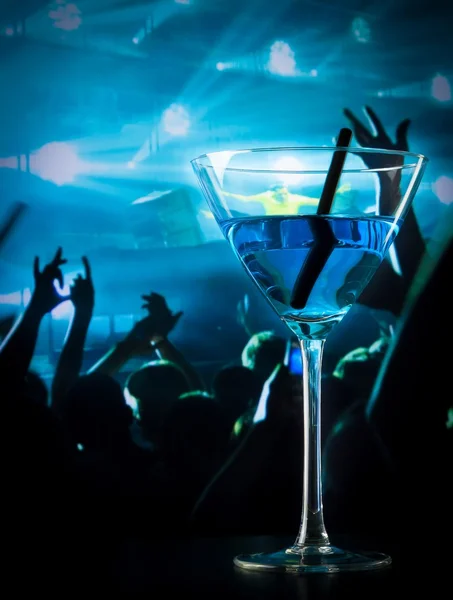 Blue cocktail drink on a disco table with space for text