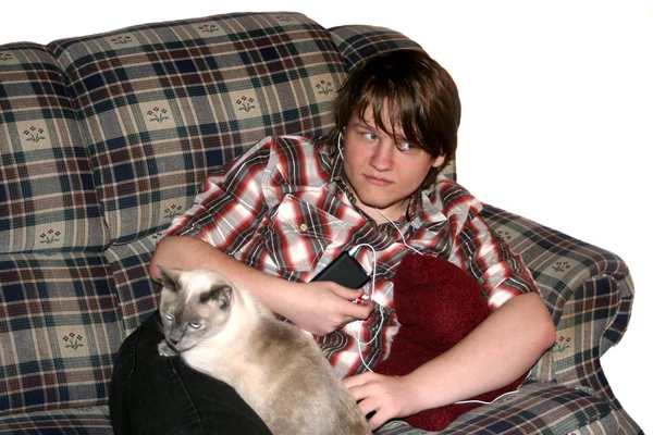 Teen Boy And Cat Listening To Music