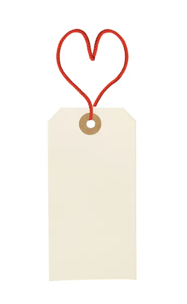 Cardboard tag with red heart ribbon isolated on white background