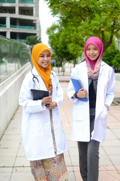 Young medical student asian muslim woman in head scarf