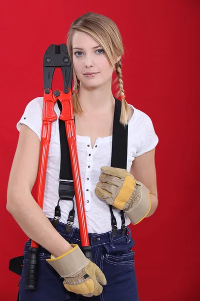 Woman holding bolt-cutters