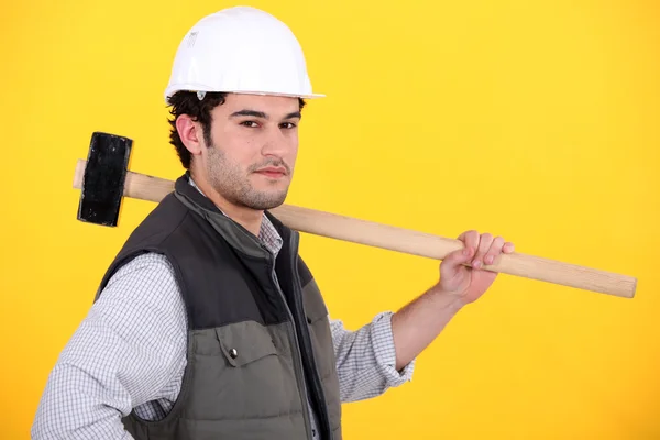 Tradesman holding a mallet