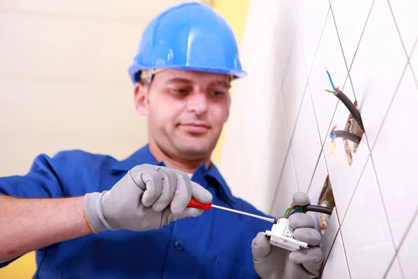 Electrician using screwdriver