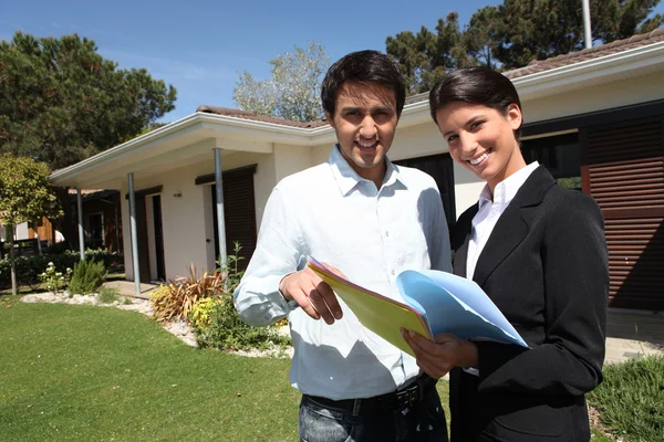 Young man and a real estate agent