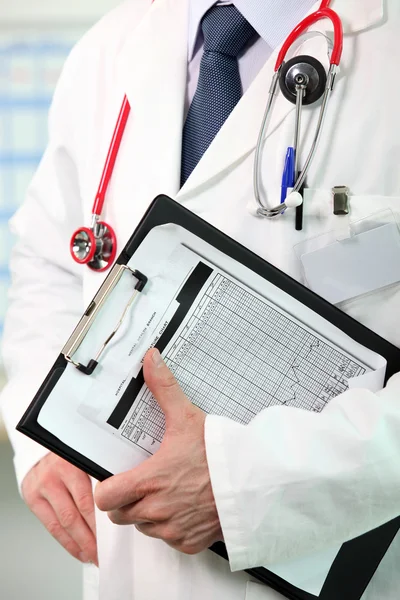 Doctor holding clipboard with patients results