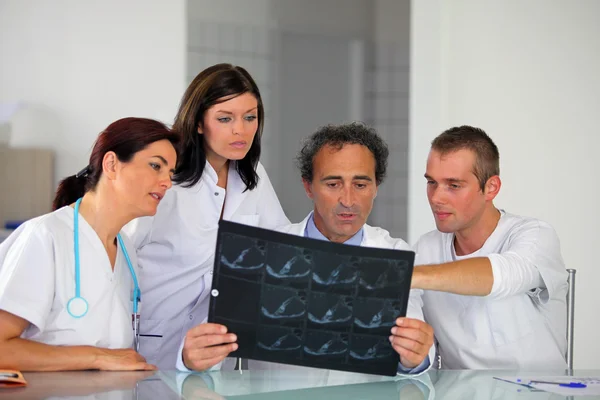 Hospital staff looking at an x-ray