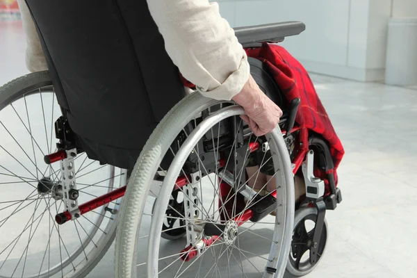 Elderly person in wheelchair