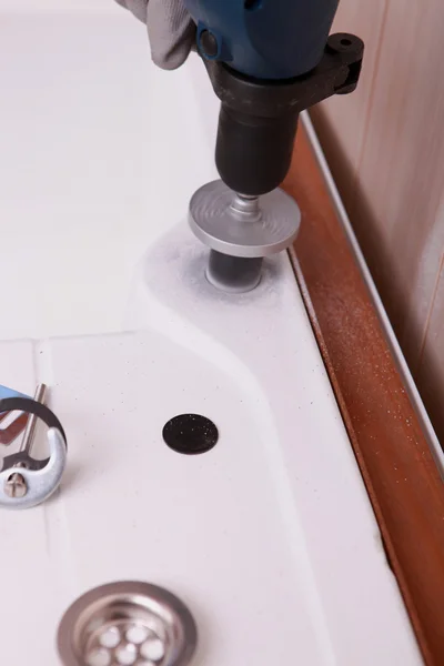 Drill work in a sink