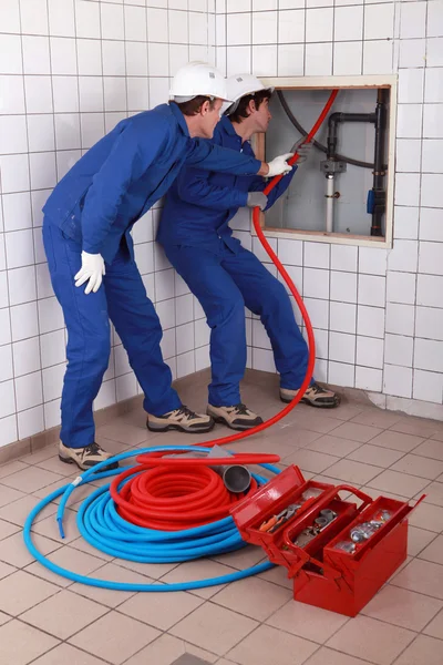 Apprentice plumber training on-the-job