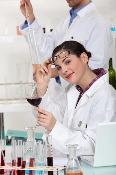 Experts testing wine in a laboratory