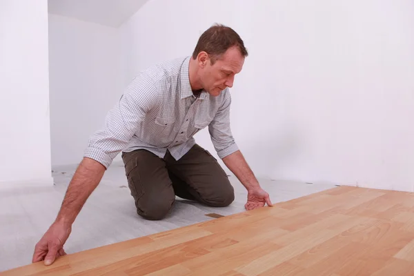 Portrait of a man laying parquet