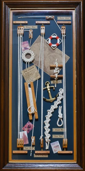 Collage of knots, ropes, life buoys and anchors
