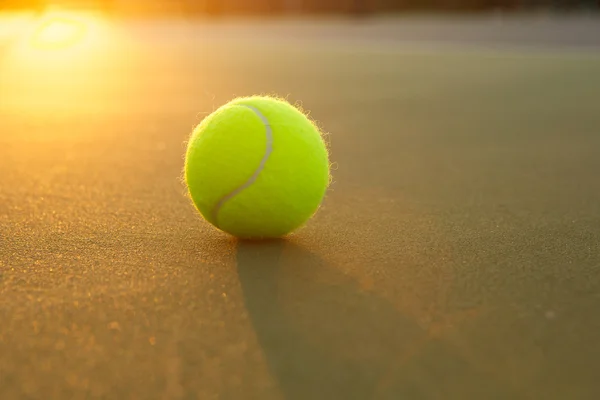 Tennis Ball Backlit by the Fading Sun