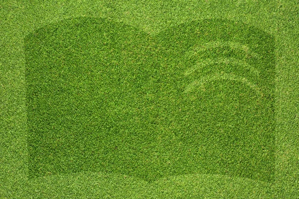 Book icon on green grass background