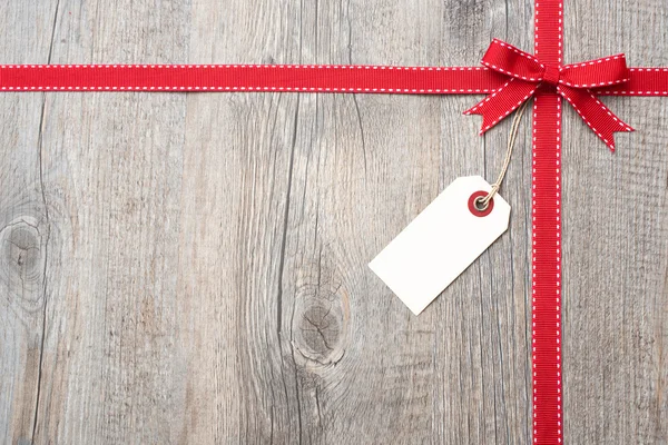 Red ribbon and bow with address label