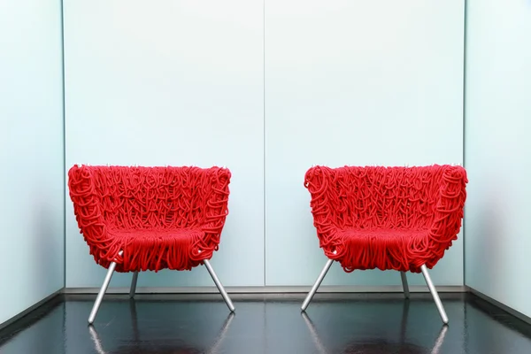 Red armchair in waiting room
