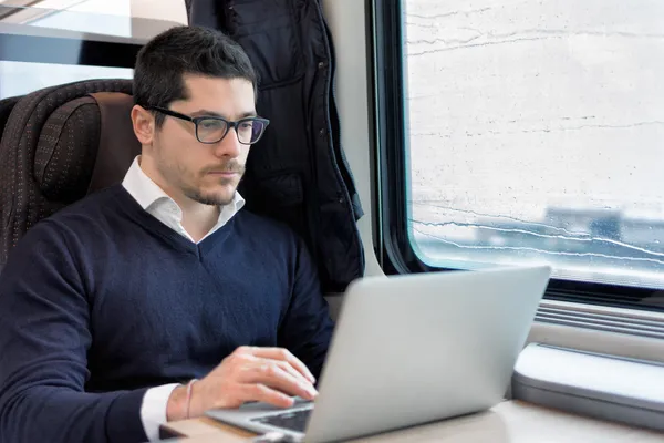 Commuter working on a train