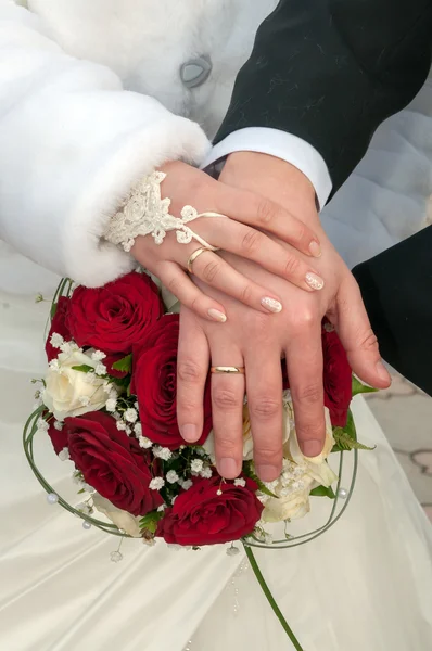 Wedding couple showing rings