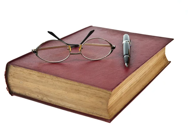 Old books with eye glasses and pen isolated on white background