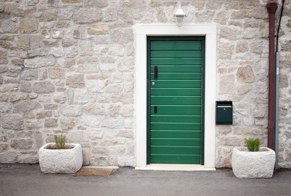 Green door in old stone house