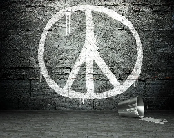 Graffiti wall with peace sign, street background