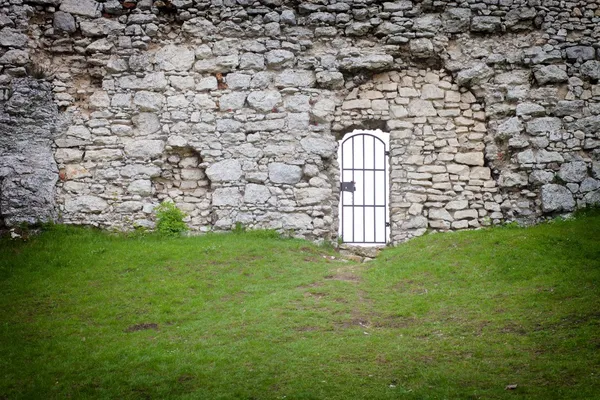 Gate in old stone castle wall, architectural detail