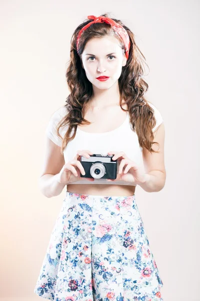 Pretty pin up girl and vintage camera