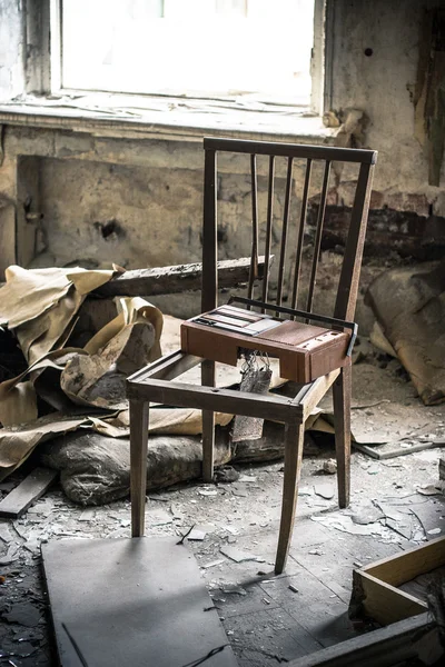 Old chair in abandoned room