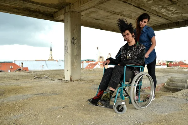 Punk boy in a wheelchair