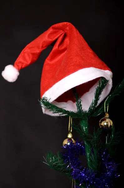 Christmas background decorated tree with santa hat on it