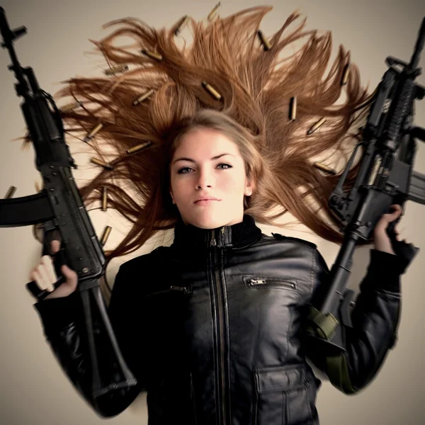 depositphotos_38931427-Woman-with-two-guns.jpg