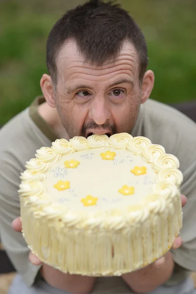Man and birthday cake