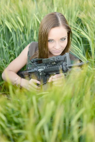 Sexy woman holding up her weapon