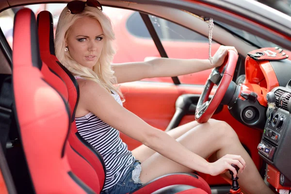 Woman sitting in the sport car