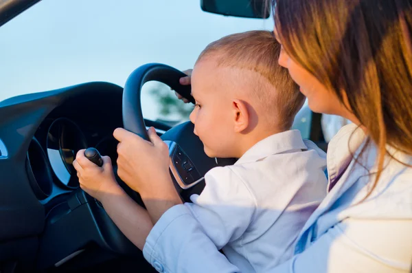 Small boy learning to drive