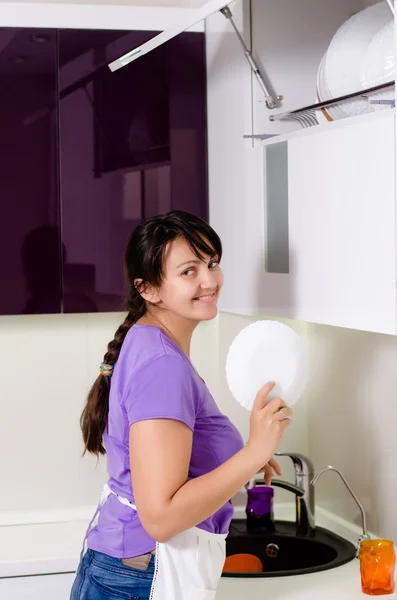 Attractive housewife doing the dishes