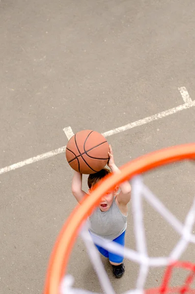 Young boy playing basketball