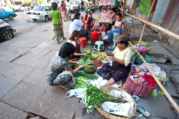 Myanmar February 2010. Roadside stalls selling fresh produce and cooked food are common sights on the streets of Yangon, Myanmar.