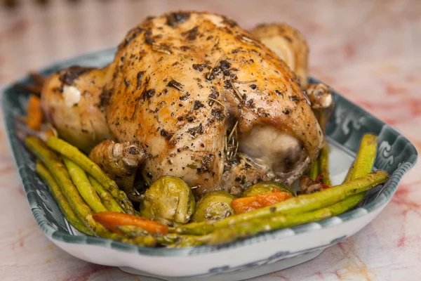 Delicious roast chicken with roasted asparagus and vegetables