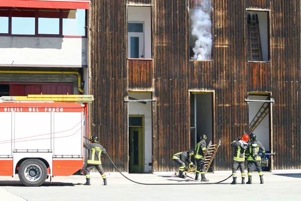 Firefighters during an exercise and try to shut down a fire