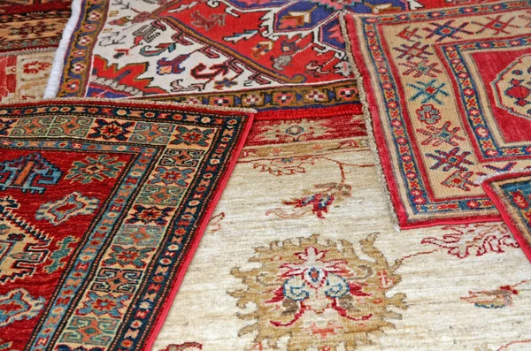 Collection of antique oriental carpets expensive on display in t