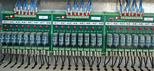 Electrical panel with circuit boards and relay electrical contac